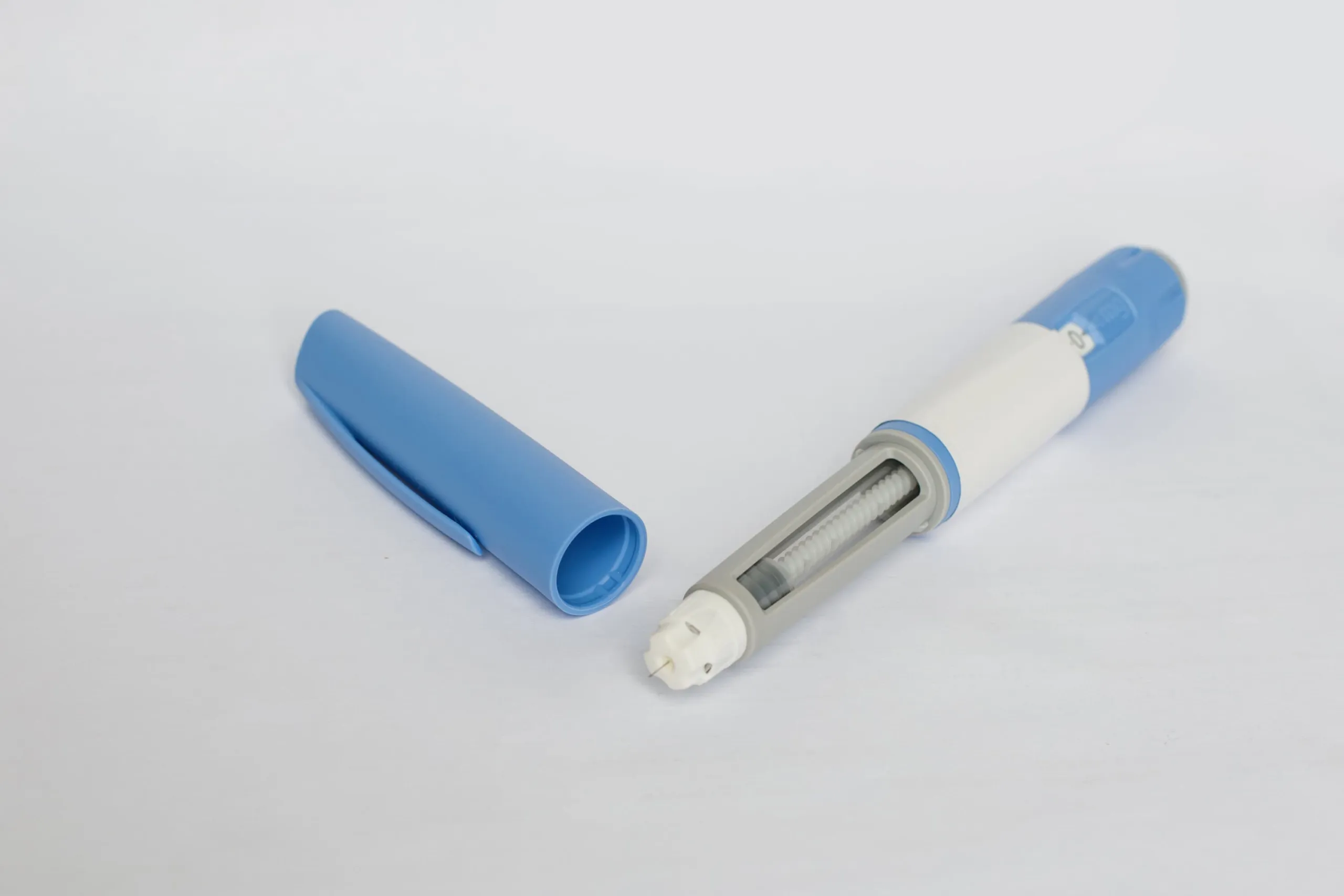 Close-up of a dosing pen used for self-administered subcutaneous injection