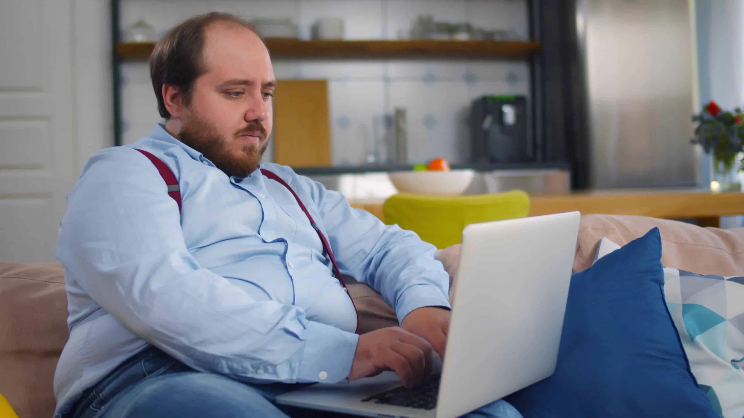 A man working on a laptop at home