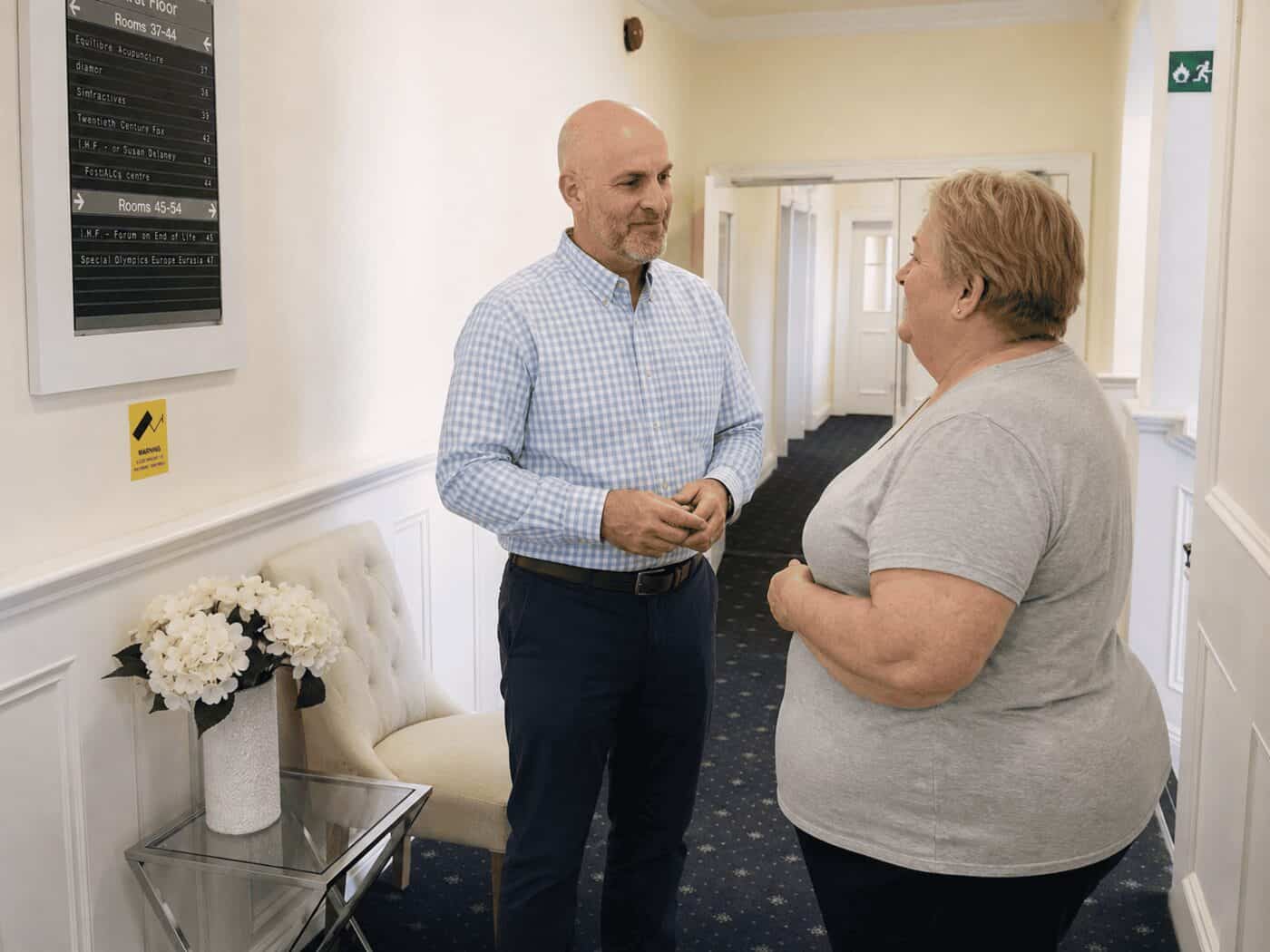 A patient being welcomed into the clinic