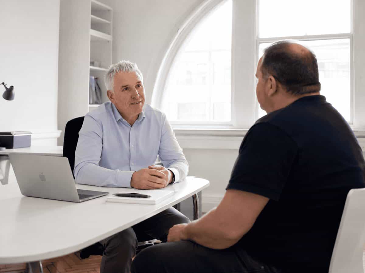 Dr David McGrane in consultation with a patient at The Weight Loss Medics