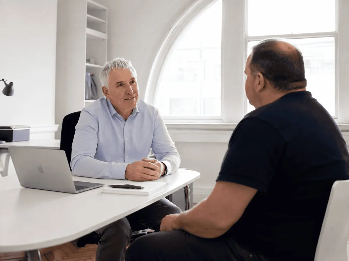 Dr David McGrane in consultation with a patient at The Weight Loss Medics