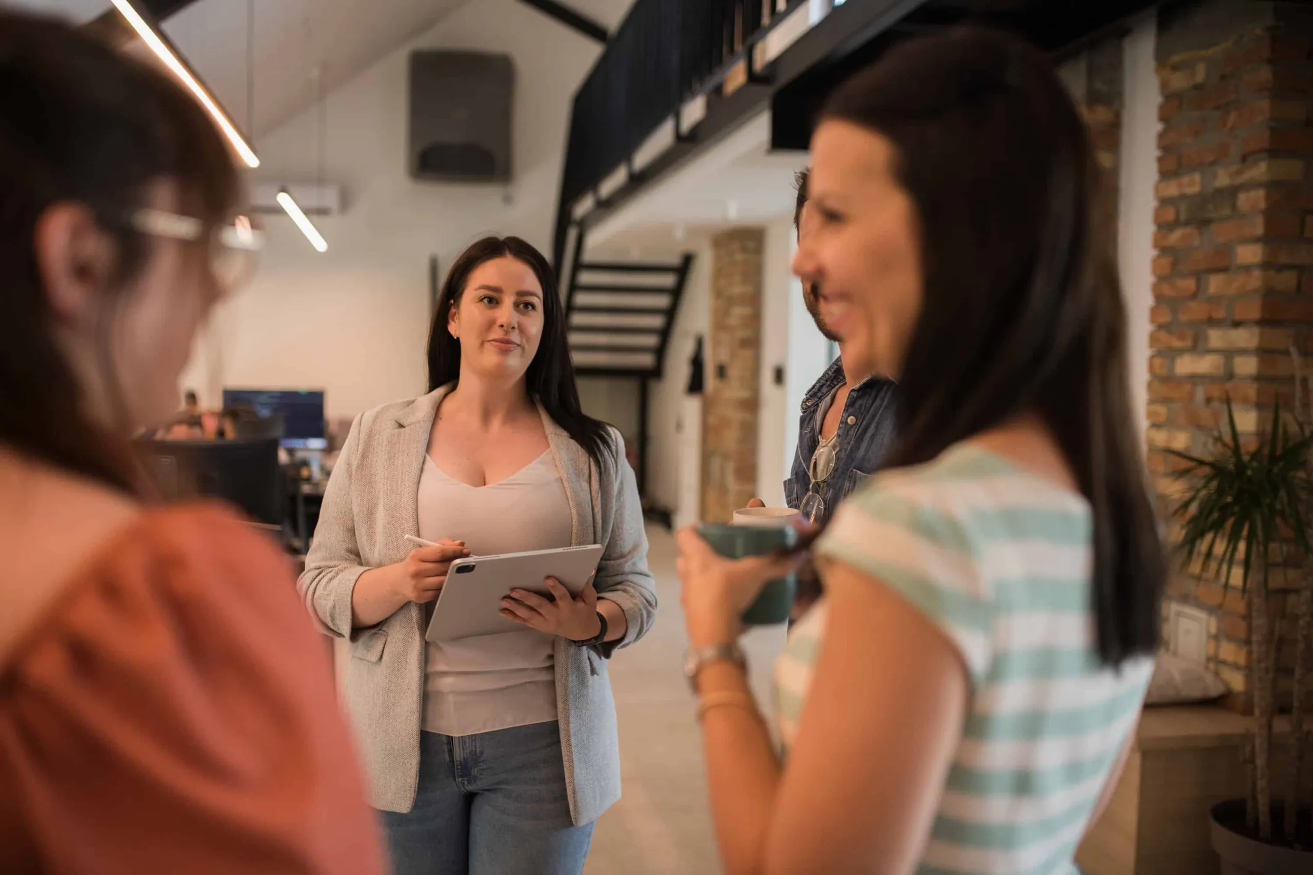 Colleagues talking together during a break at work